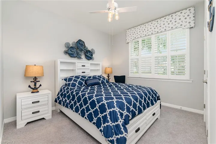 Bedroom with carpet floors and ceiling fan