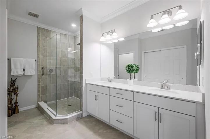 Owner's Bath with Dual Sinks and Frameless Walk-In Shower