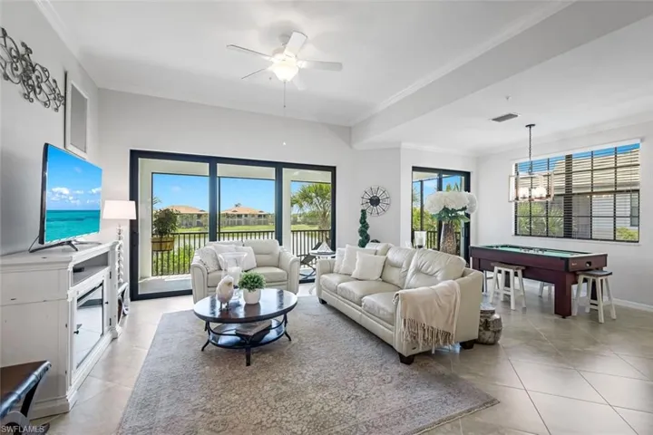 Great Room with Wall of Windows Overlooking Lake with Water Feature
