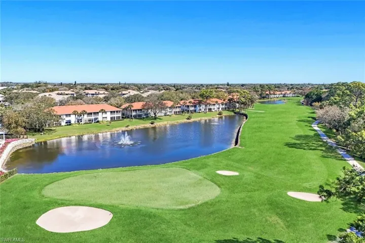 View of property's community featuring a water view and view of golf course