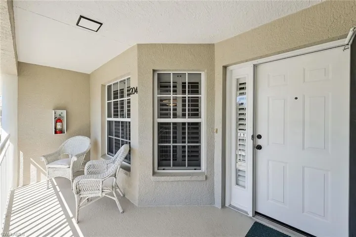 Property entrance with stucco siding