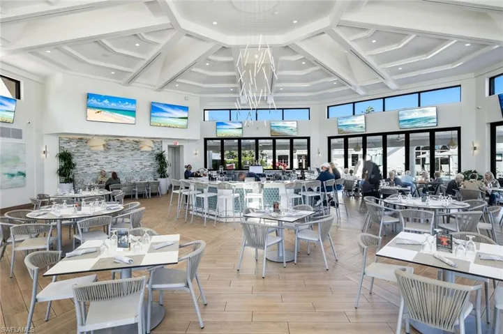 Dining area featuring wood tiled floors and coffered ceiling
