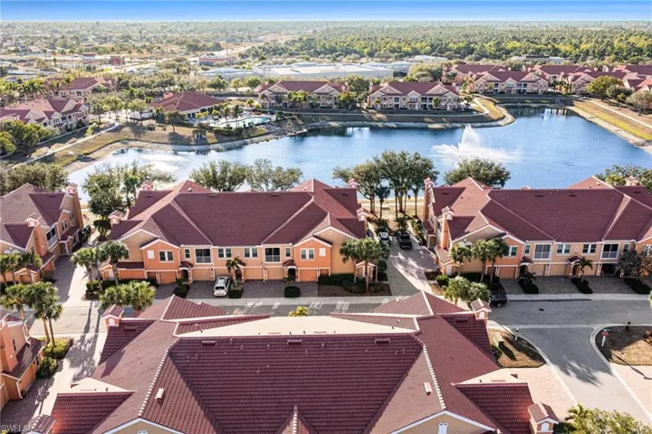 Aerial perspective of suburban area with a nearby body of water