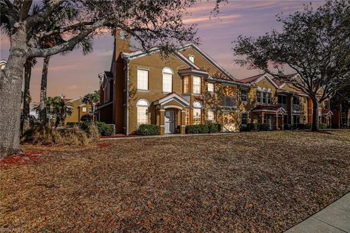 View of front of house featuring stucco siding