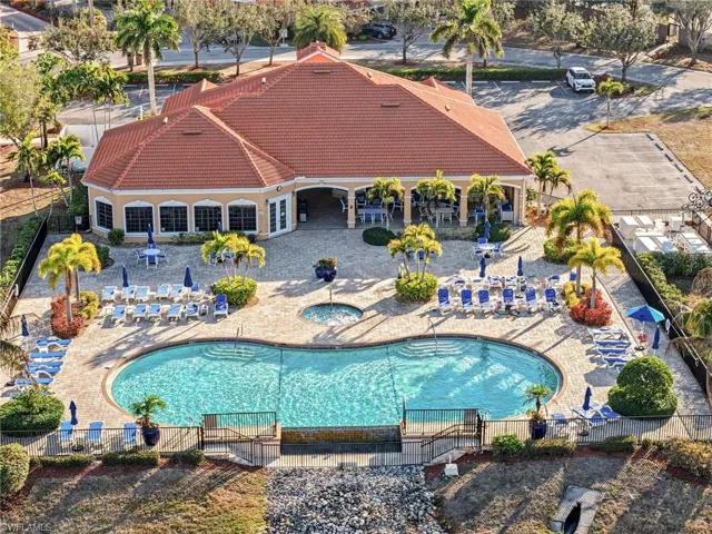 Community pool with a patio