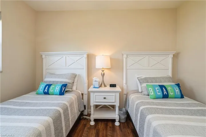 Bedroom with dark wood-type flooring