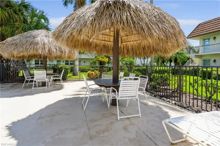 View of patio with a balcony