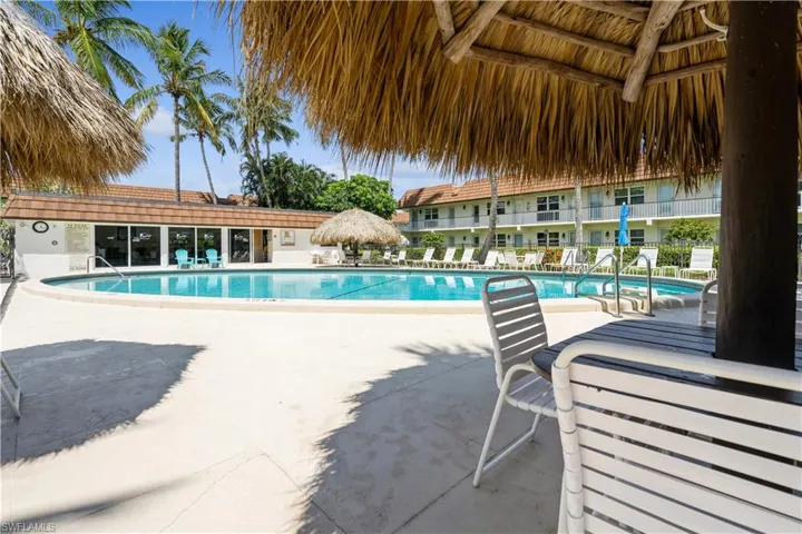 View of swimming pool with a gazebo and a patio area