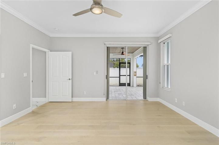 Masterbedroom with hardwood flooring