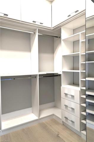 Custom designed walk-in closet in Master suite.