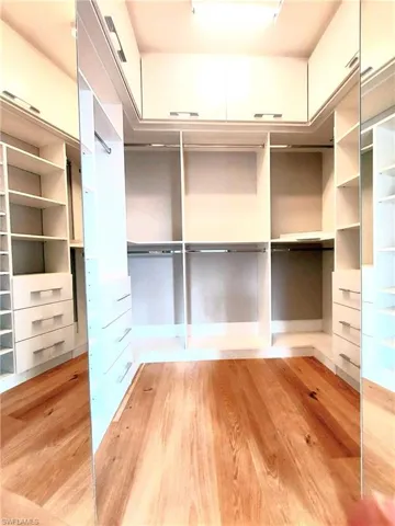 Newly re-finished hardwood floors in walk-in closet/Master suite