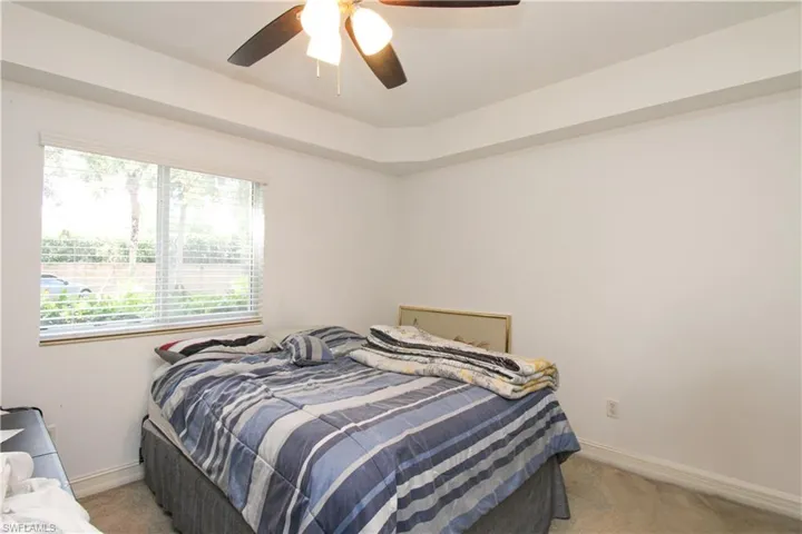 Bedroom with carpet flooring and ceiling fan