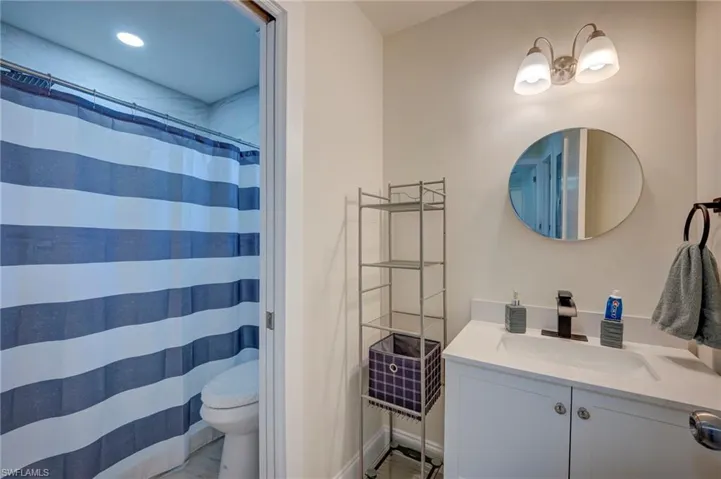 Full bath featuring vanity and a shower with curtain