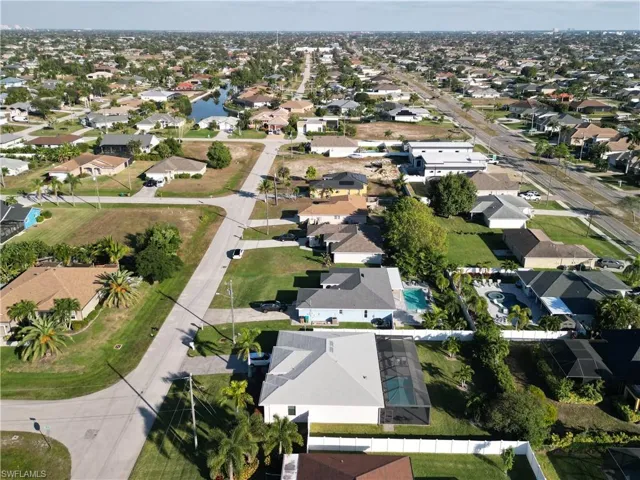 View of property location with nearby suburban area