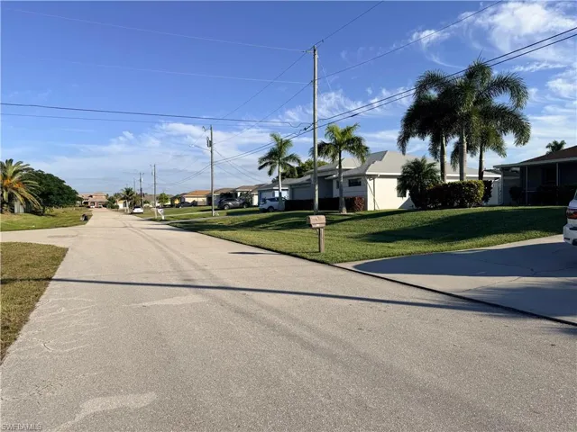 View of asphalt street featuring a residential view