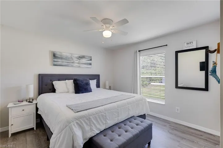 Bedroom featuring wood finished floors and a ceiling fan