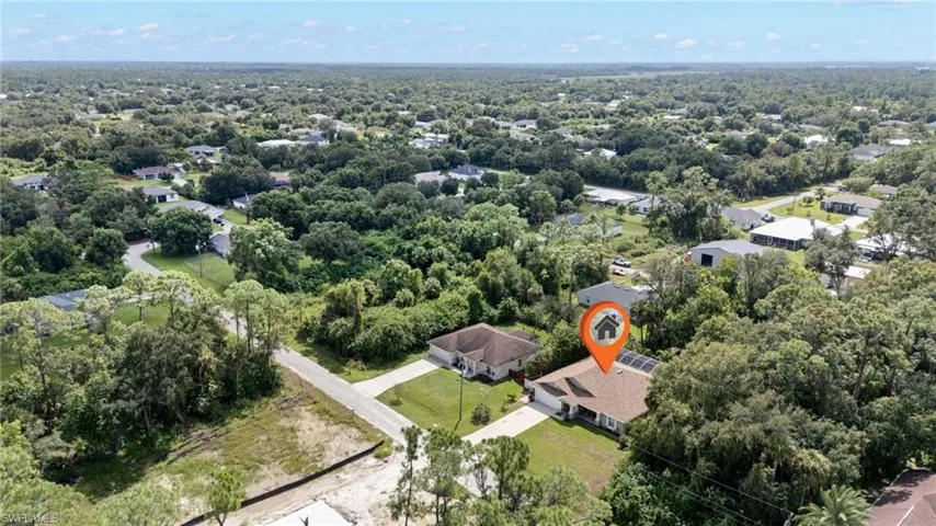 Aerial overview of property's location featuring nearby suburban area