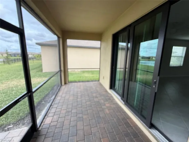 Unfurnished sunroom featuring plenty of natural light