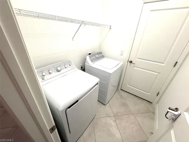 Washroom featuring separate washer and dryer