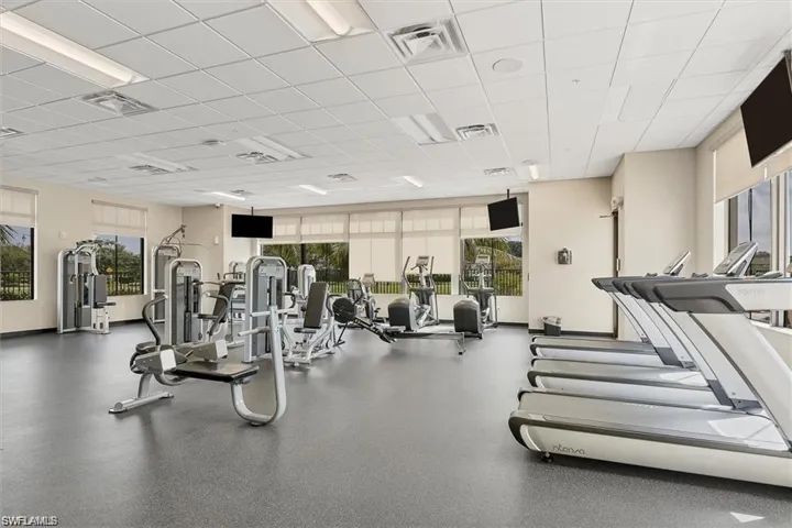 Workout area with a paneled ceiling