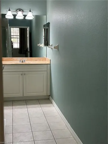 Bathroom featuring vanity, Walk in Shower and Walk in Closet.