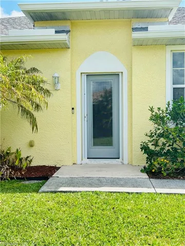 Doorway to property Side Entrance with Screen Door.