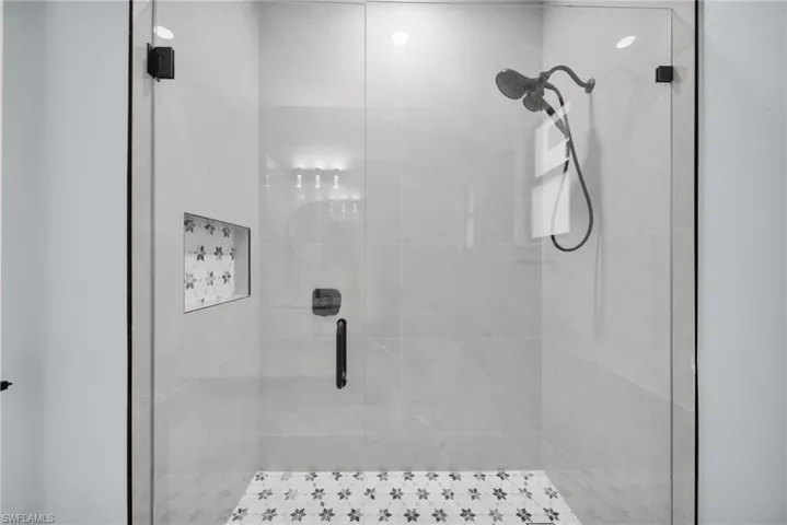 Full bath with a shower stall