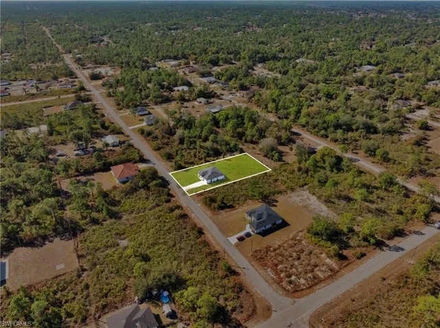 View of property location with a forest