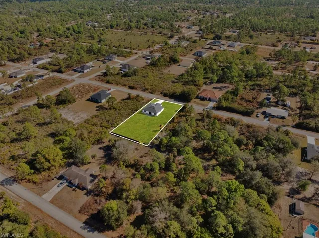 Aerial view of property's location with property boundaries highlighted and nearby suburban area