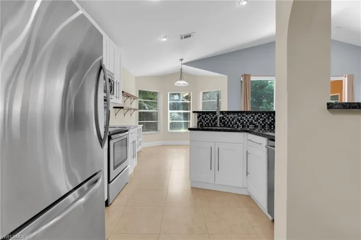 The Kitchen Comes With Granite Countertops, Deep Stainless-Steel Sink, Ceiling To Floor Pantry, Breakfast Bar, Stainless Steel Appliances, White Wood Custom Cabinets And Drawers, And A Tile Backsplash!