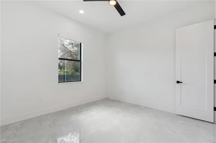 Spare room with ceiling fan