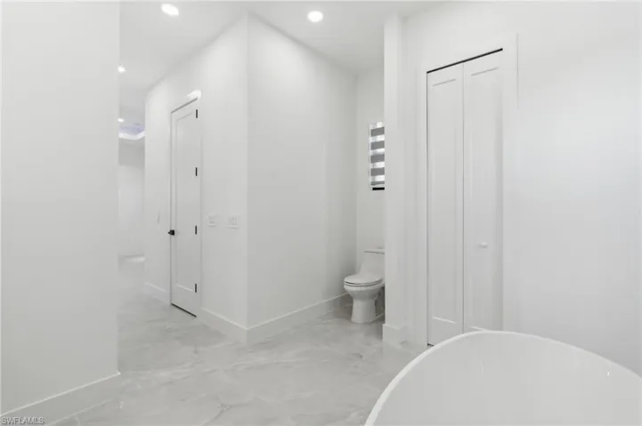 Bathroom with a bath and toilet