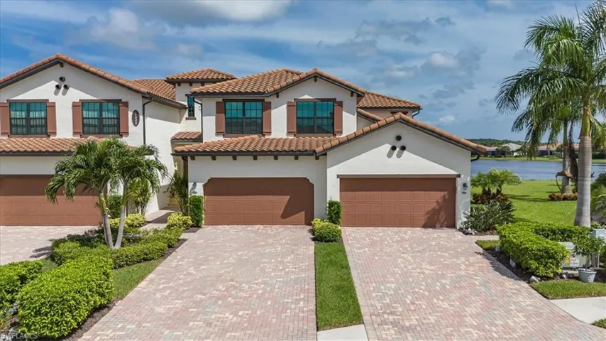 Mediterranean / spanish home featuring a garage