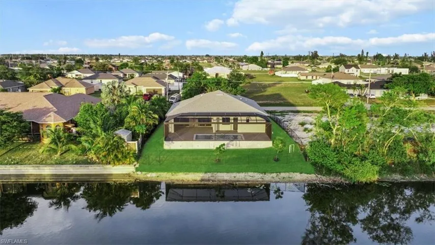 Aerial perspective of suburban area with a large body of water