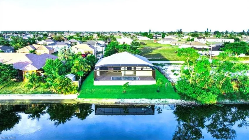 Aerial view of residential area with a large body of water