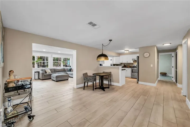 Living area featuring wood plank porcelain tile flooring