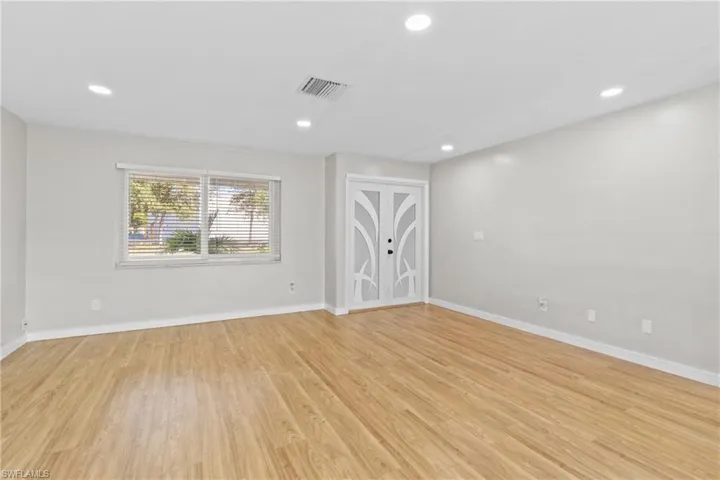 Empty room featuring recessed lighting and light wood finished floors