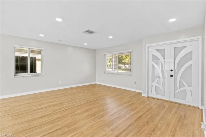 Spare room with recessed lighting and light wood-style flooring