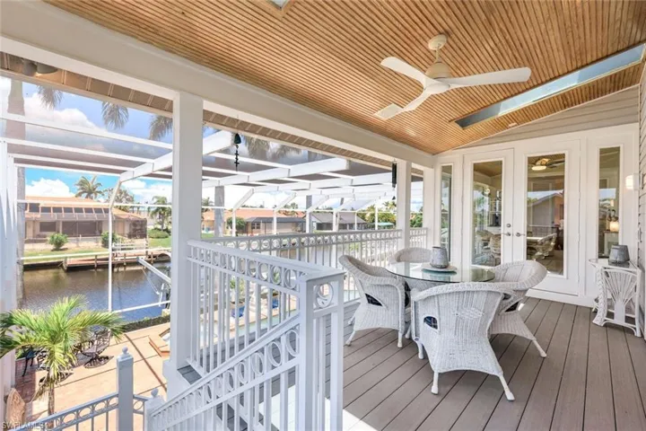 Screened in balcony overlooking the pool and canal