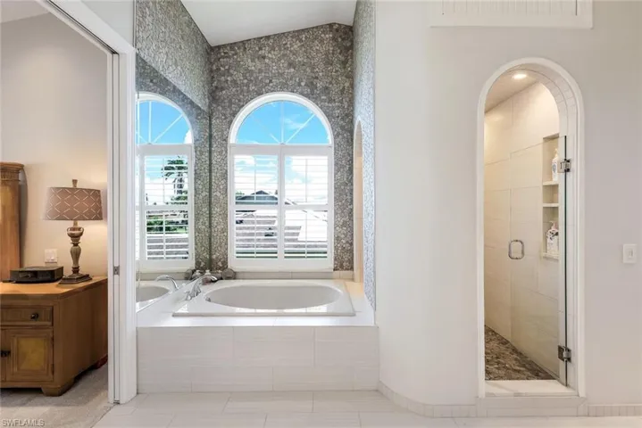 Custom designed walk-in shower with high-end “rain” shower. Separate bathtub for relaxing spa baths.