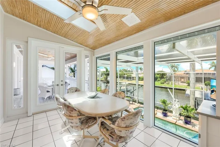 Enjoy meals overlooking the pool and water. Ceiling to Floor Impact windows.