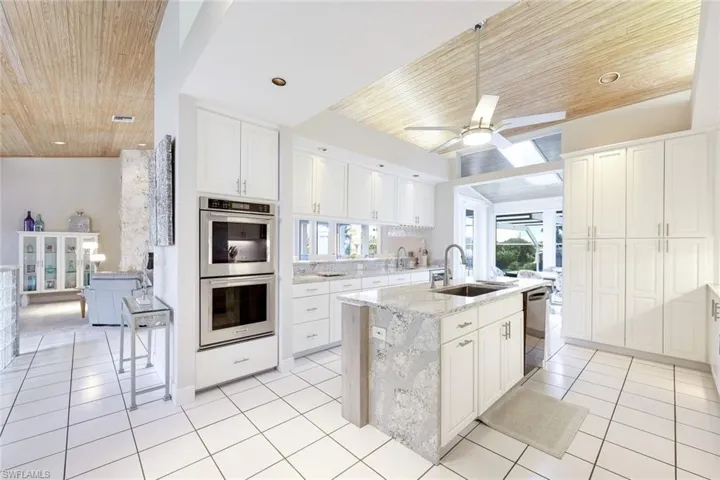 Equipped with wine cooler, stunning countertops and custom cabinets.