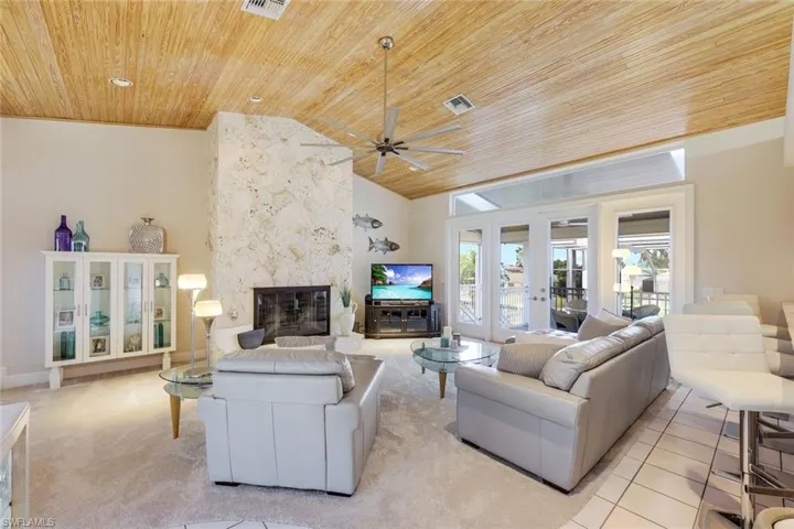 Look at these cathedral ceilings! Real Coral Fireplace.