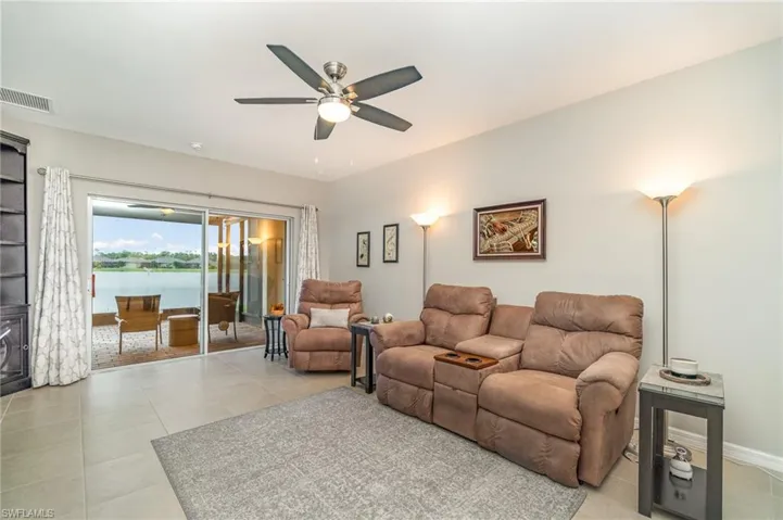 Tiled living room with ceiling fan