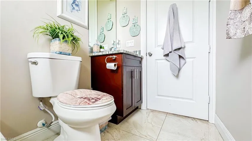Bathroom with vanity, tile patterned flooring, and toilet