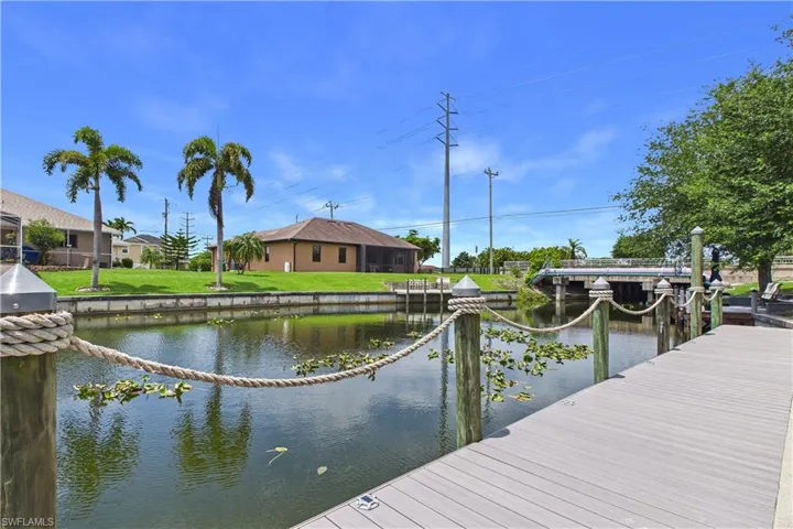 Spacious waterfront decking featuring composite material and rope railings