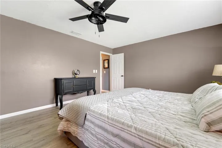 Bedroom featuring hardwood / wood-style flooring and ceiling fan