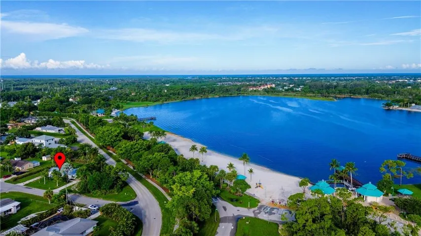 Birds eye view of property with a water view