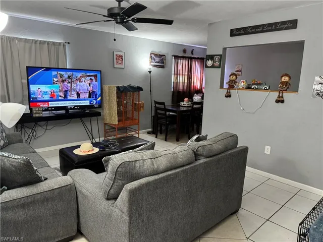 Tiled living room with ceiling fan