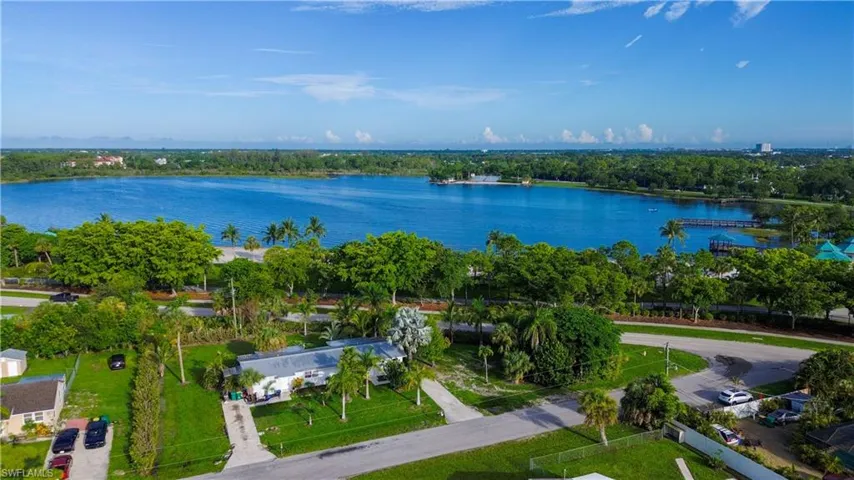 Birds eye view of property with a water view